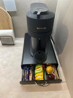 a coffee maker sitting on top of a table at Arcus by Aestas Suites in Artemida