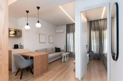 a small apartment with a kitchen and a living room at Serene 1BR Apartment in the Heart of Athens in Athens