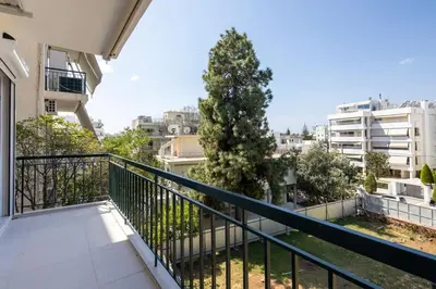 a balcony of a apartment with a tree at Bloom - Luxury 2-Bedroom Apartment in Athens in Athens