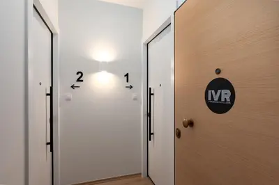 a hallway with a door with a light on it at Calm 1BR Apartment in the Heart of Athens in Athens