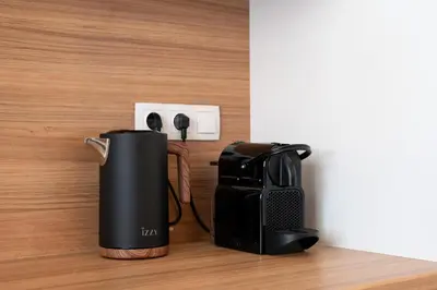 a coffee maker plugged into an electrical outlet at Calm 1BR Apartment in the Heart of Athens in Athens