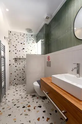 a bathroom with a sink and a toilet at Calm 1BR Apartment in the Heart of Athens in Athens
