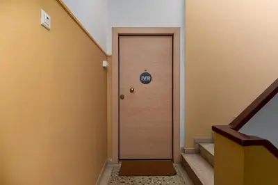 a door in a hallway with a sign on it at Calm 1BR Apartment in the Heart of Athens in Athens