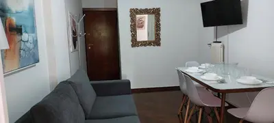 a living room with a table and a couch and a dining room at Magnolia Apartment -4BD , 1.5 BT in Athens