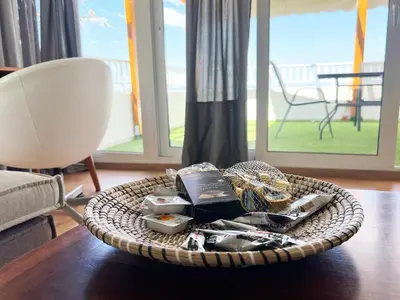 a basket of food on a table in a living room at Riviera View in Athens