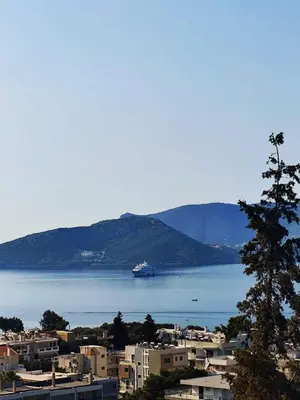 a cruise ship in a large body of water at Studio with unique view near the beach! in Porto Rafti