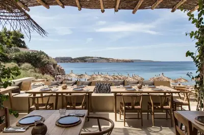 a restaurant with a view of the ocean at Atlantis Riviera Beachfront Fast WiFi in Athens