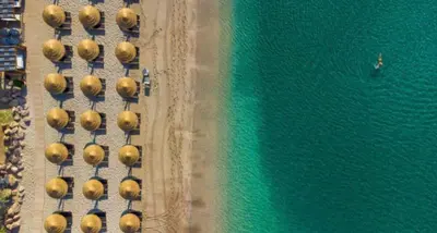 an aerial view of a group of cars parked next to the ocean at Atlantis Riviera Beachfront Fast WiFi in Athens