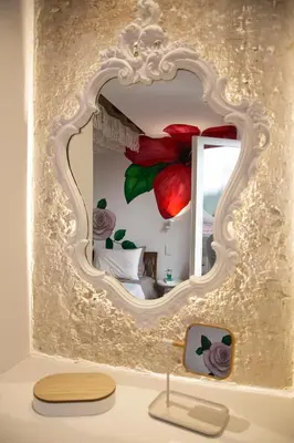 a mirror on a wall in a room at Boutique apartment near Acropolis in Athens