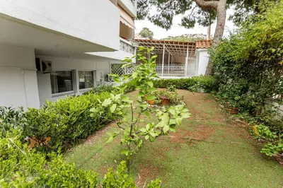 a plant in the yard of a house at Athens Riviera Hermes Coastal Residence in Athens