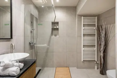 a bathroom with a shower and a sink and a toilet at Athens Riviera Hermes Coastal Residence in Athens
