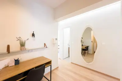 a dining room with a mirror and a table at Three Bedroom Stylish Apt next to Acropolis in Athens