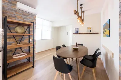 a dining room with a table and chairs at Three Bedroom Stylish Apt next to Acropolis in Athens