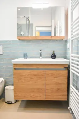 a bathroom with a sink and a toilet at Spacious apartment in Athens in Athens