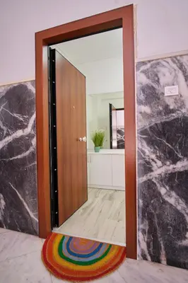 a door with a mirror in a room at Central Cozy House in Athens