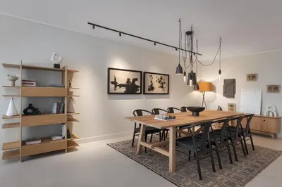 a dining room with a wooden table and chairs at Casa Amalia in Aghia Marina