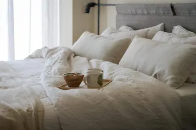 a candle and a bowl on a plate on a bed at Casa Amalia in Aghia Marina