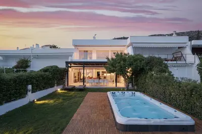 a backyard with a swimming pool and a house at Casa Amalia in Aghia Marina