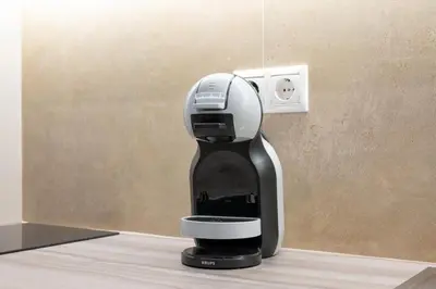 a coffee maker sitting on a counter next to a wall at Elegant Zen 2BR Apartment in Athens in Athens
