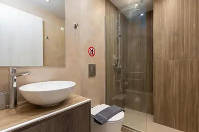 a bathroom with a sink and a shower at Elegant Zen 2BR Apartment in Athens in Athens