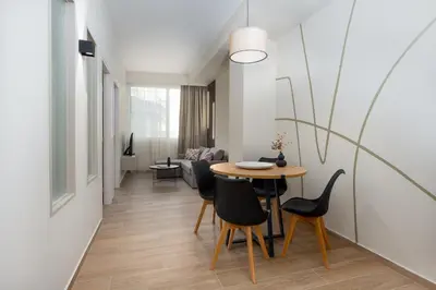 a dining room with a table and chairs at Elegant Zen 2BR Apartment in Athens in Athens