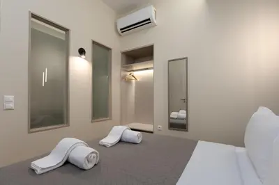 a bedroom with two white towels on a bed at Elegant Zen 2BR Apartment in Athens in Athens