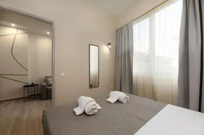 a bedroom with two towels on a bed at Elegant Comfort 2BR Apartment in Athens in Athens