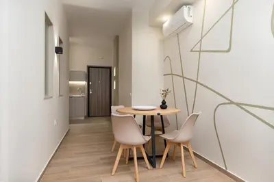 a dining room with a table and chairs at Elegant Comfort 2BR Apartment in Athens in Athens