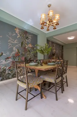 a dining room with a wooden table and chairs at Elegant Escape 2BR BA Sunny Apt in Athens