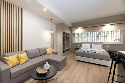a living room with a couch and a bed at Elegant Studio Apartment in Athens in Athens