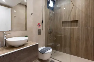a bathroom with a toilet and a sink and a shower at Elegant Studio Apartment in Athens in Athens