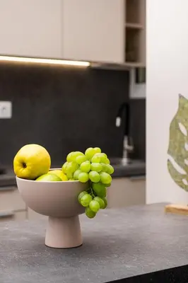 a bowl of fruit on a counter in a kitchen at Glyfada First Class Suite by First Class Properties in Athens
