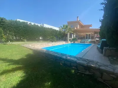 a swimming pool in the yard of a house at Ablaze Luxury Athens in Glyka Nera