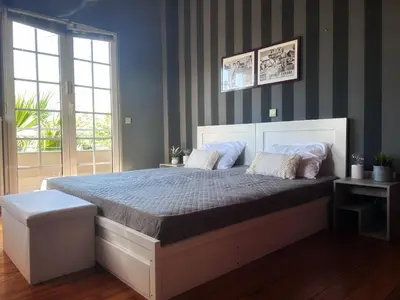a bedroom with a large bed in a room at Ablaze Luxury Athens in Glyka Nera