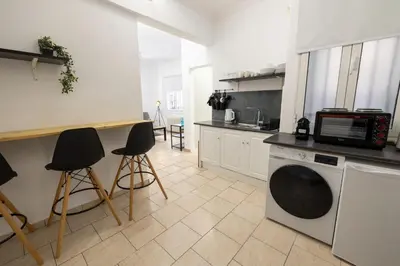 a kitchen with a washer and a microwave at Phaedrus Living Athens City Studios Paris in Athens