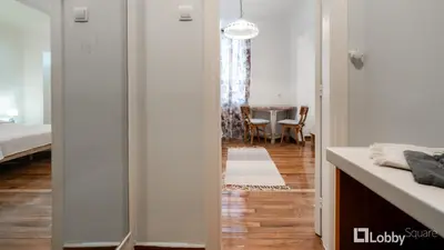 a room with a hallway with a table and a dining room at Vea Studio Plaka in Athens