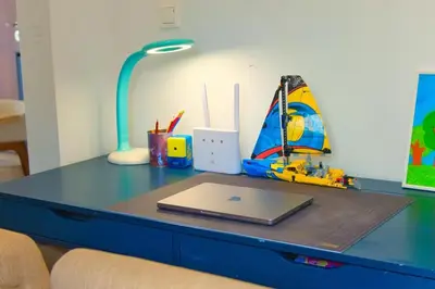 a desk with a laptop and a lamp on it at Acropolis Landscape in Athens
