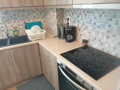 a kitchen with a sink and a counter top at Lavender-Ryan spacious apartment for live and work in heart of Athens in Athens