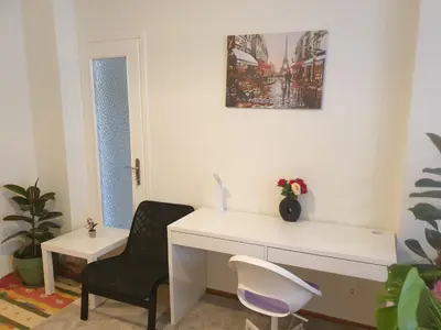 a white desk and a chair in a room at Lavender-Ryan spacious apartment for live and work in heart of Athens in Athens
