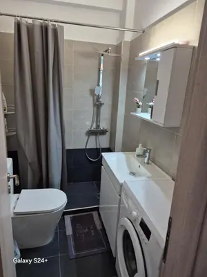 a bathroom with a white sink and a toilet at Lavender-Ryan spacious apartment for live and work in heart of Athens in Athens