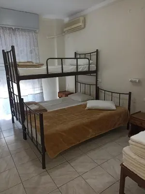 a bedroom with two bunk beds in a room at Elite Hotel in Athens