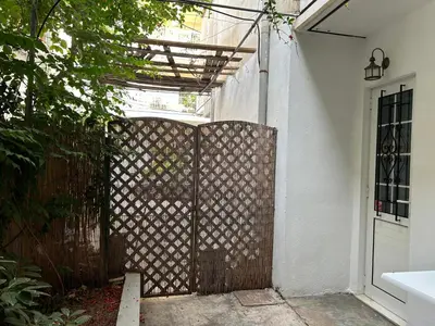an entrance to a house with an iron gate at Urban lodge Agios Dimitrios in Athens