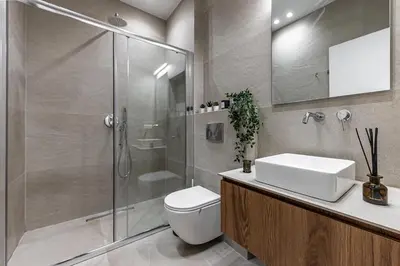 a bathroom with a shower and a toilet and a sink at Phaedrus Living Prosperity Residences Paradise in Athens