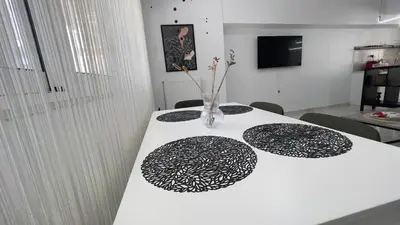 a white table with a vase on top of it at Walk into Dream of Acropolis 11 in Athens