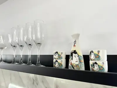 a shelf with wine glasses and a vase at Walk into Dream of Acropolis 11 in Athens