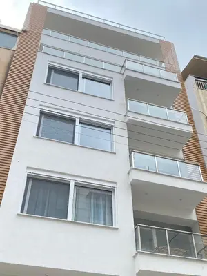 an apartment building with windows on the side of it at Walk into Dream of Acropolis 11 in Athens