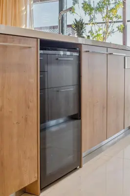 a kitchen with a stainless steel dishwasher under a counter at Penthouse Sauna & Jacuzzi in Glyfada in Athens