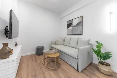 a living room with a couch and a table at Phaedrus Living Prosperity Residences Harmony in Athens