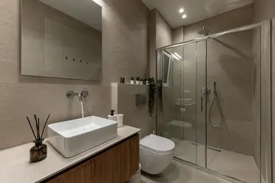 a bathroom with a toilet and a sink and a shower at Phaedrus Living Prosperity Residences Harmony in Athens