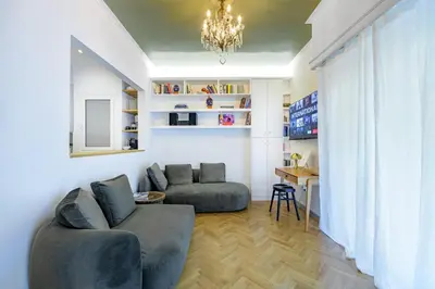 a living room with a couch and a table at Luxurious & Stylish Kolonaki Haven in Athens